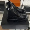 Chanel Grained Calfskin Shiny Calfskin CC Lace Up Combat Boots  Black