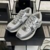 Chanel Fabric Laminated Calfskin Stretch CC Sneakers White Silver