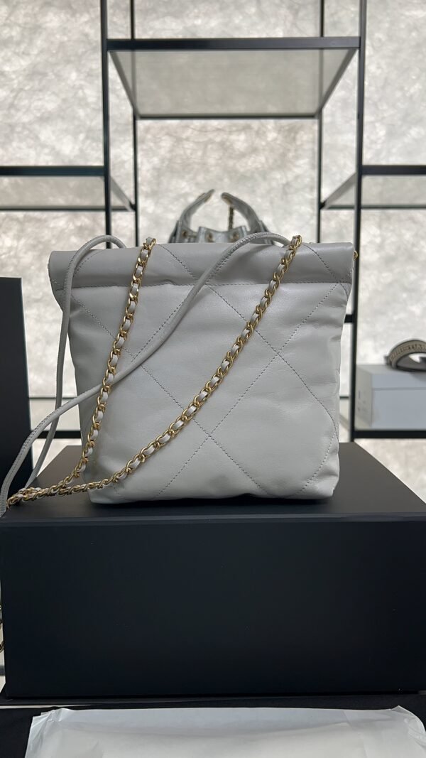 CHANEL 22 Mini Handbag Shiny Calfskin & Gold-Tone Metal Light gray