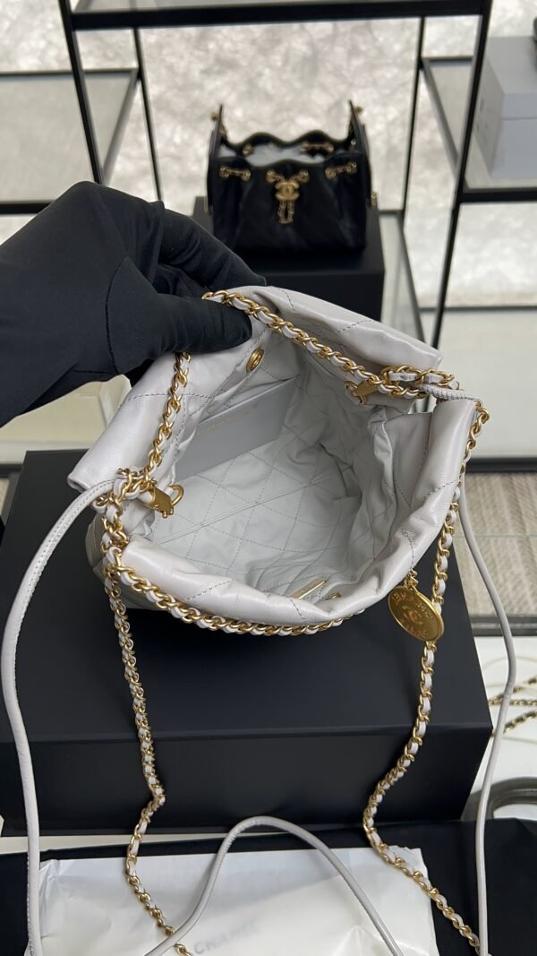 CHANEL 22 Mini Handbag Shiny Calfskin & Gold-Tone Metal Light gray