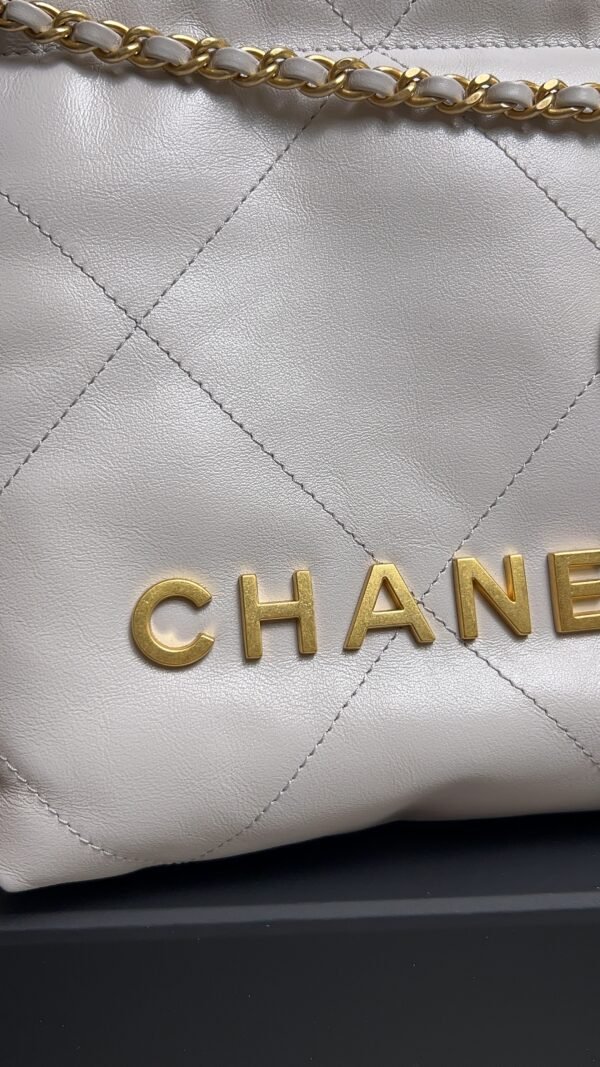 CHANEL 22 Mini Handbag Shiny Calfskin & Gold-Tone Metal Light gray