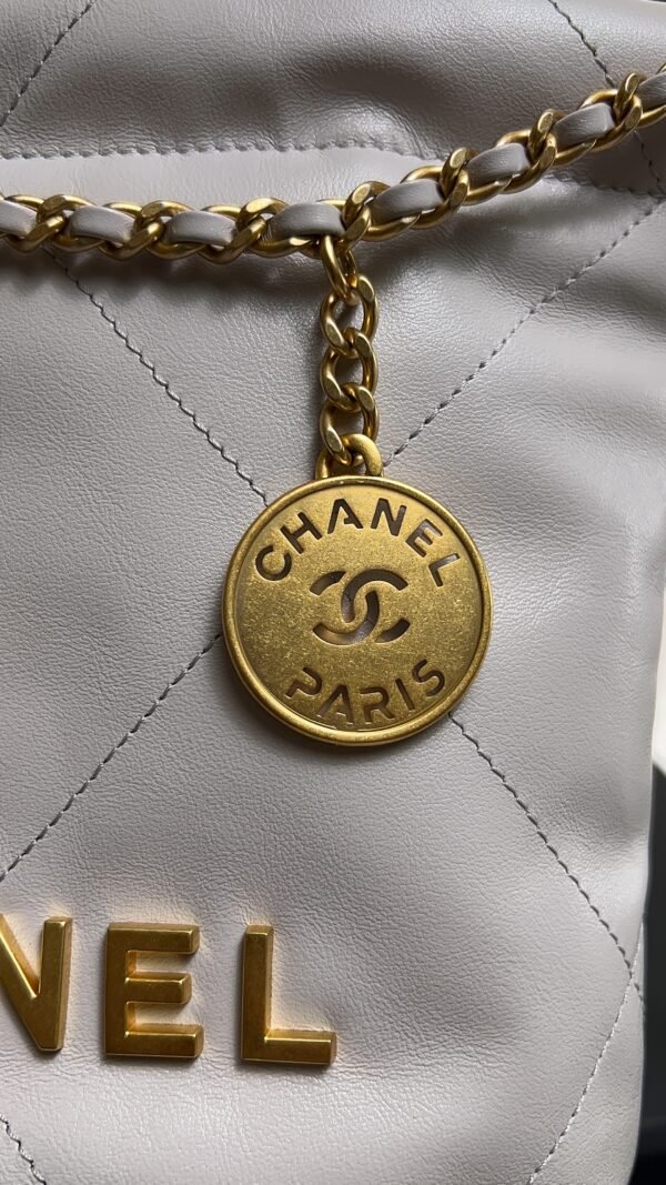 CHANEL 22 Mini Handbag Shiny Calfskin & Gold-Tone Metal Light gray