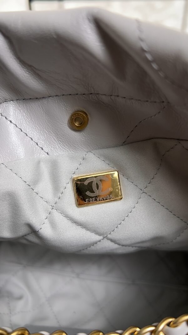 CHANEL 22 Mini Handbag Shiny Calfskin & Gold-Tone Metal Light gray