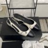 Chanel Printed Lambskin Cap Toe CC Slingback Pumps  Black White