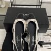 Chanel Printed Lambskin Cap Toe CC Slingback Pumps  Black White