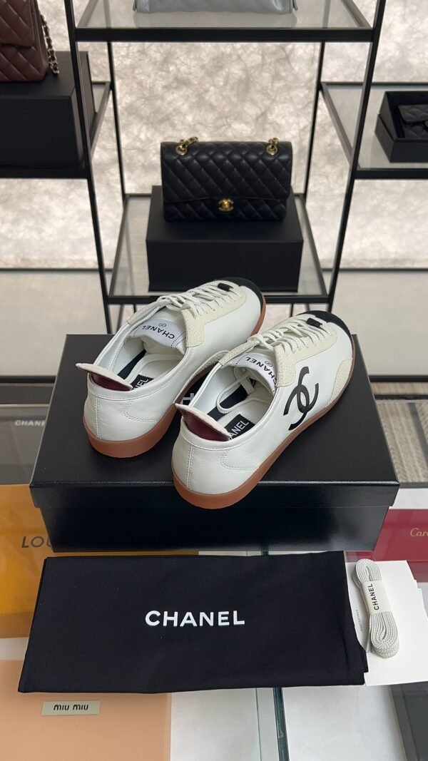 Chanel Calfskin Embossed Suede Sneakers  White Black
