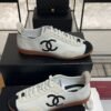 Chanel Calfskin Embossed Suede Sneakers  White Black